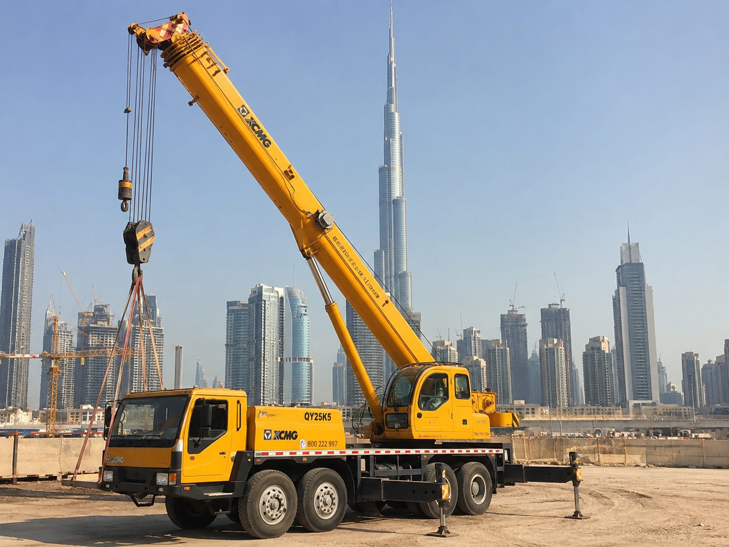 GEM mobile crane lifting against the Dubai skyline